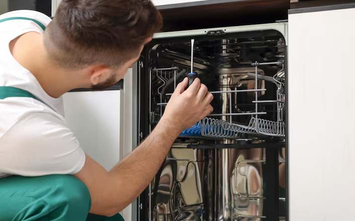 Signs your dishwasher needs repair including strange noises, leaks, and burning smells in Bristol
